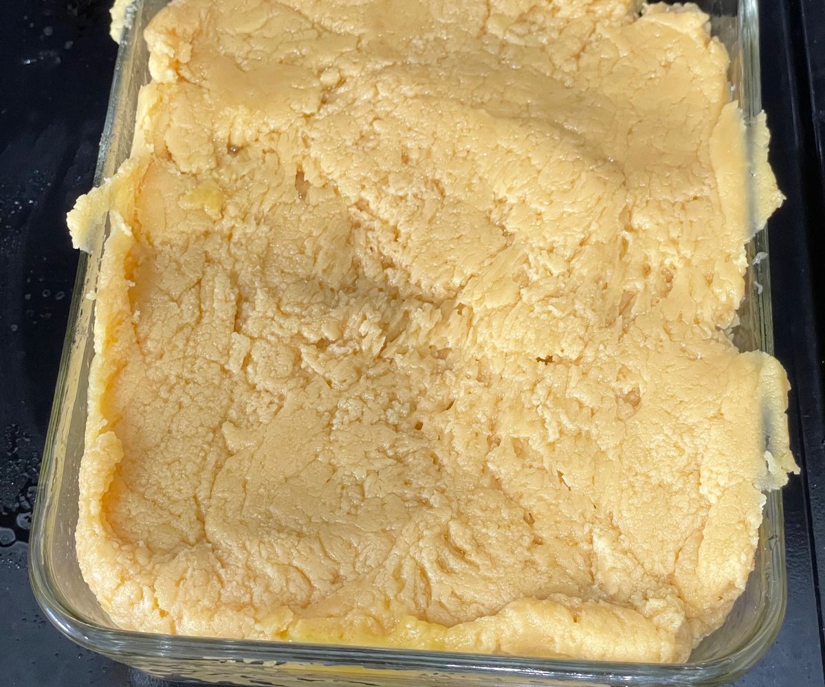 A tray is with warm mysore pak on the counter top.