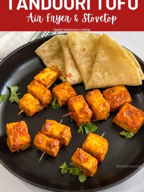 Tandoori tofu is on the plate with chapatis.