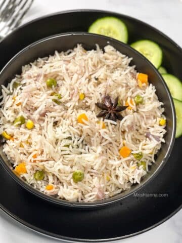 A bowl is with instant pot vegetable pulao.