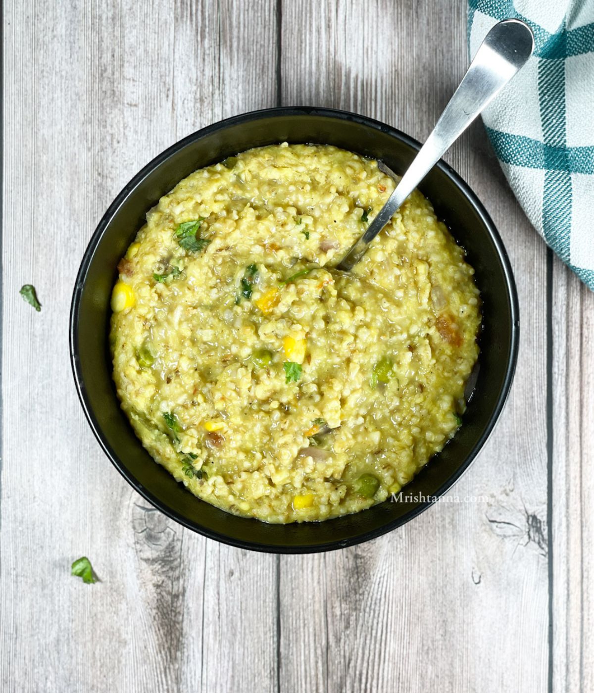 head shot of a bowl with oats khichdi.