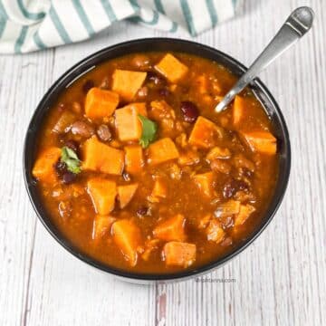 A bowl is filled with instant pot sweet potato chili.