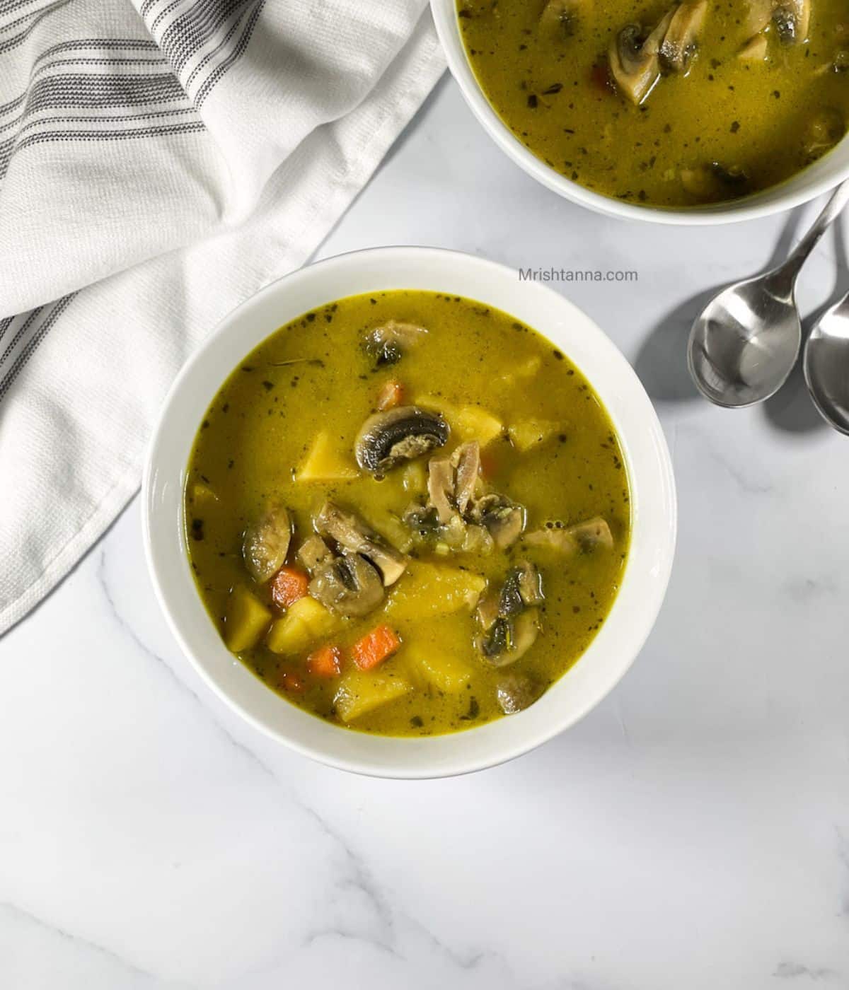 Head shot of a bowl with mushroom potato soup.