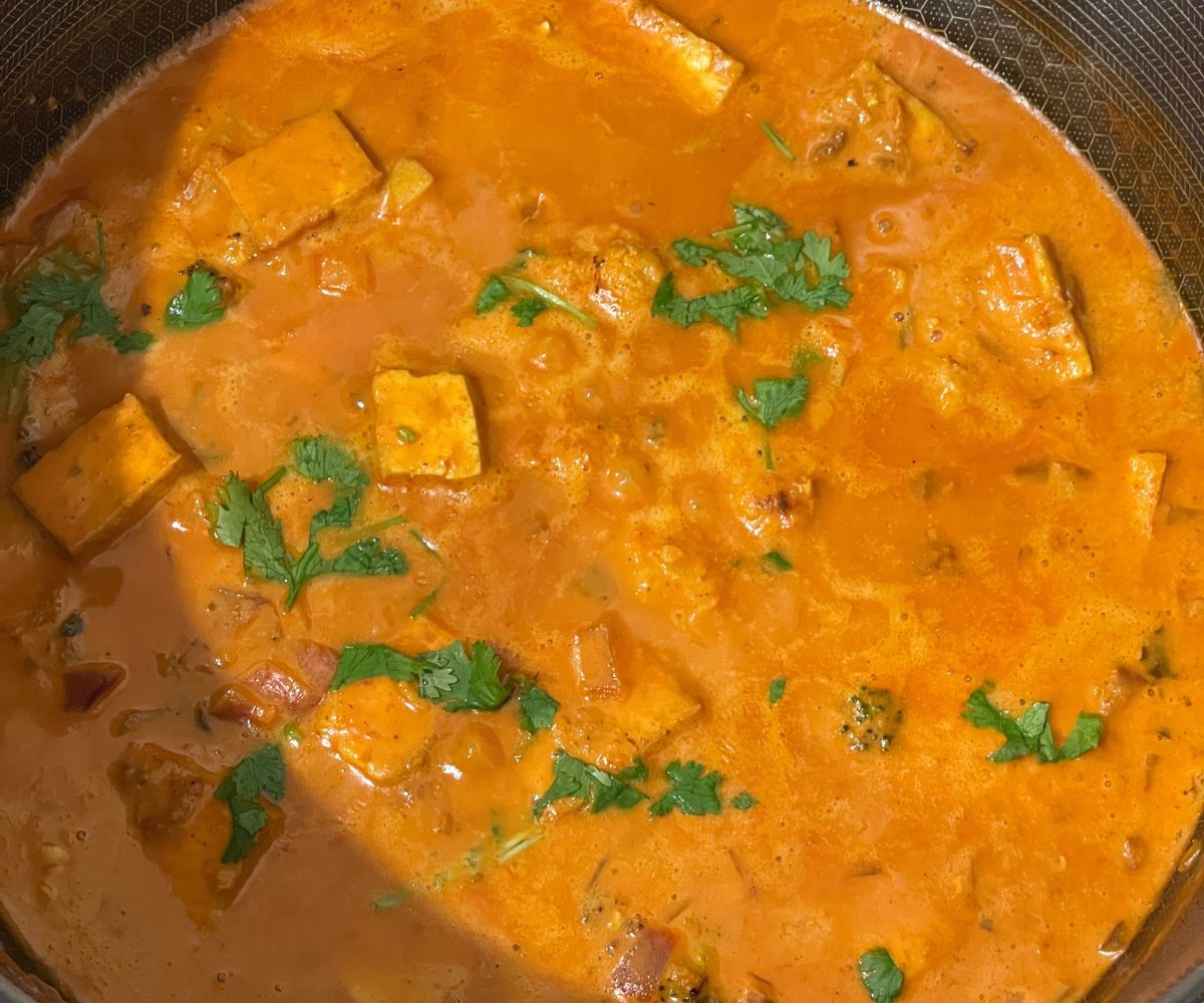 A pan is filled with vegan tikka masala curry.