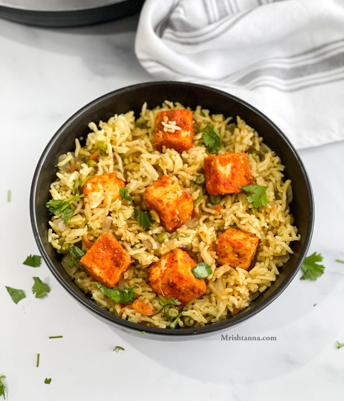 A bowl of curry rice is on the table.