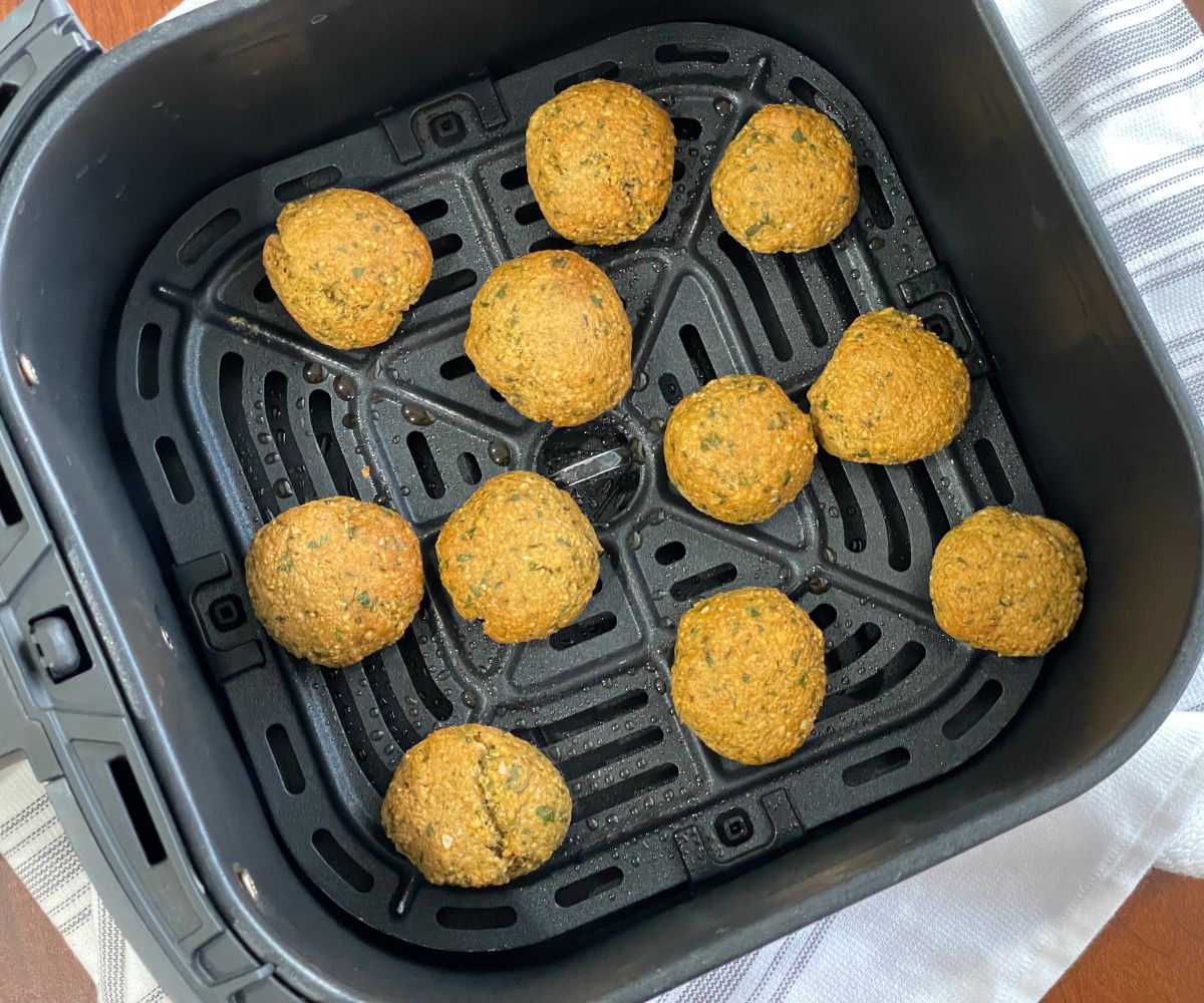 The air fryer is with falafel balls.