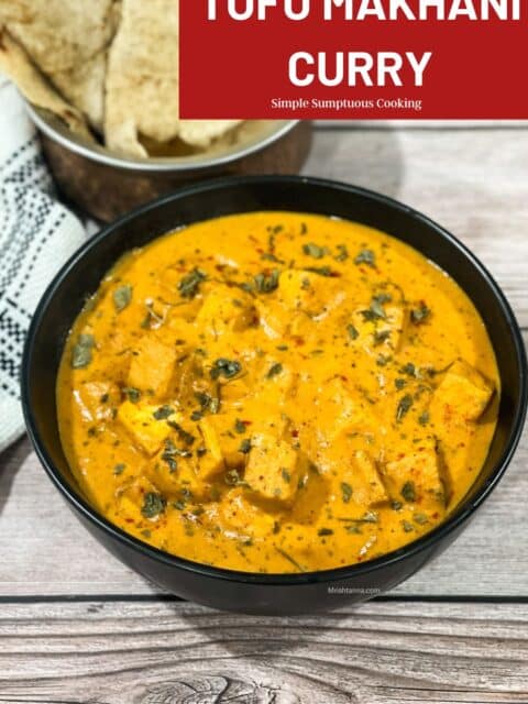 A bowl of tofu makhani curry is on the table.