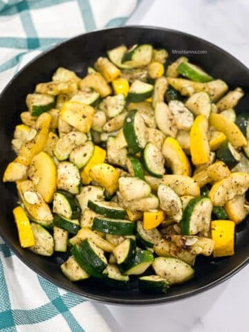 A plate of air fryer zucchini is on the table.