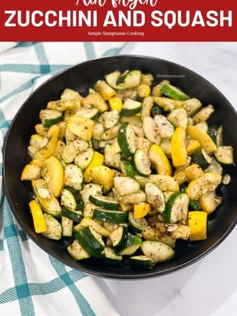A plate is with air fried zucchini and squash.