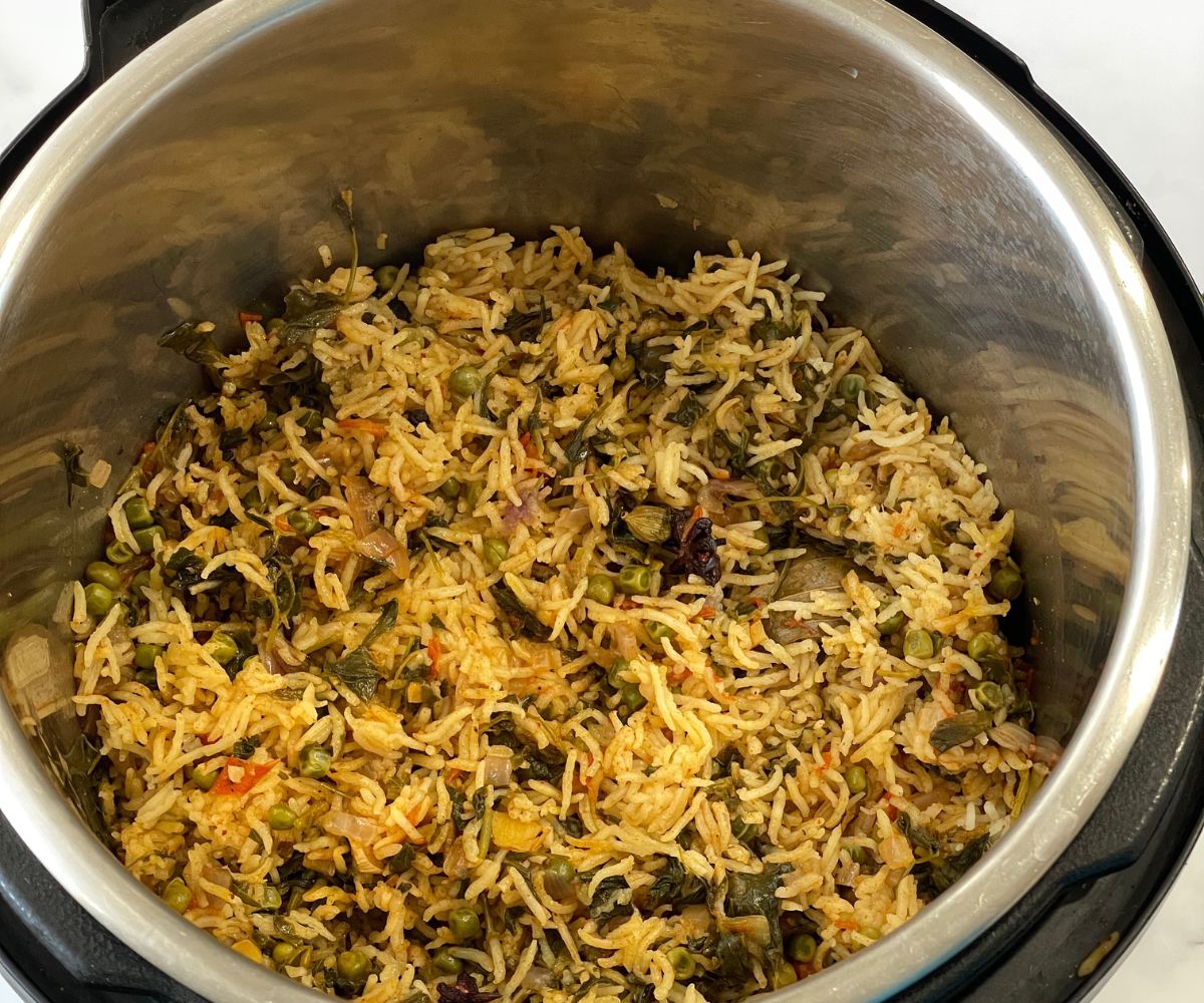 An instant pot is filled with methi pulao.