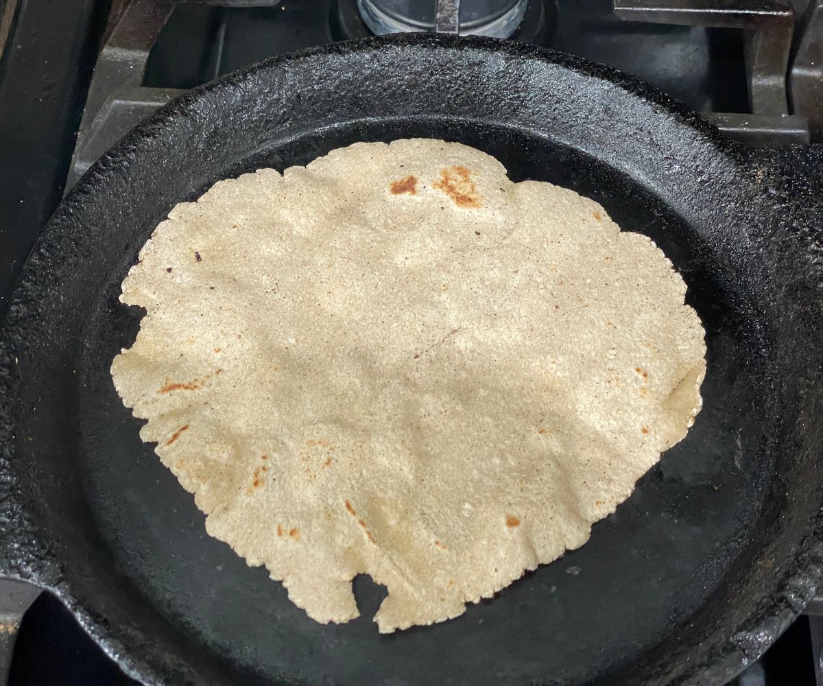 Cooked jowar rotis over the skillet.