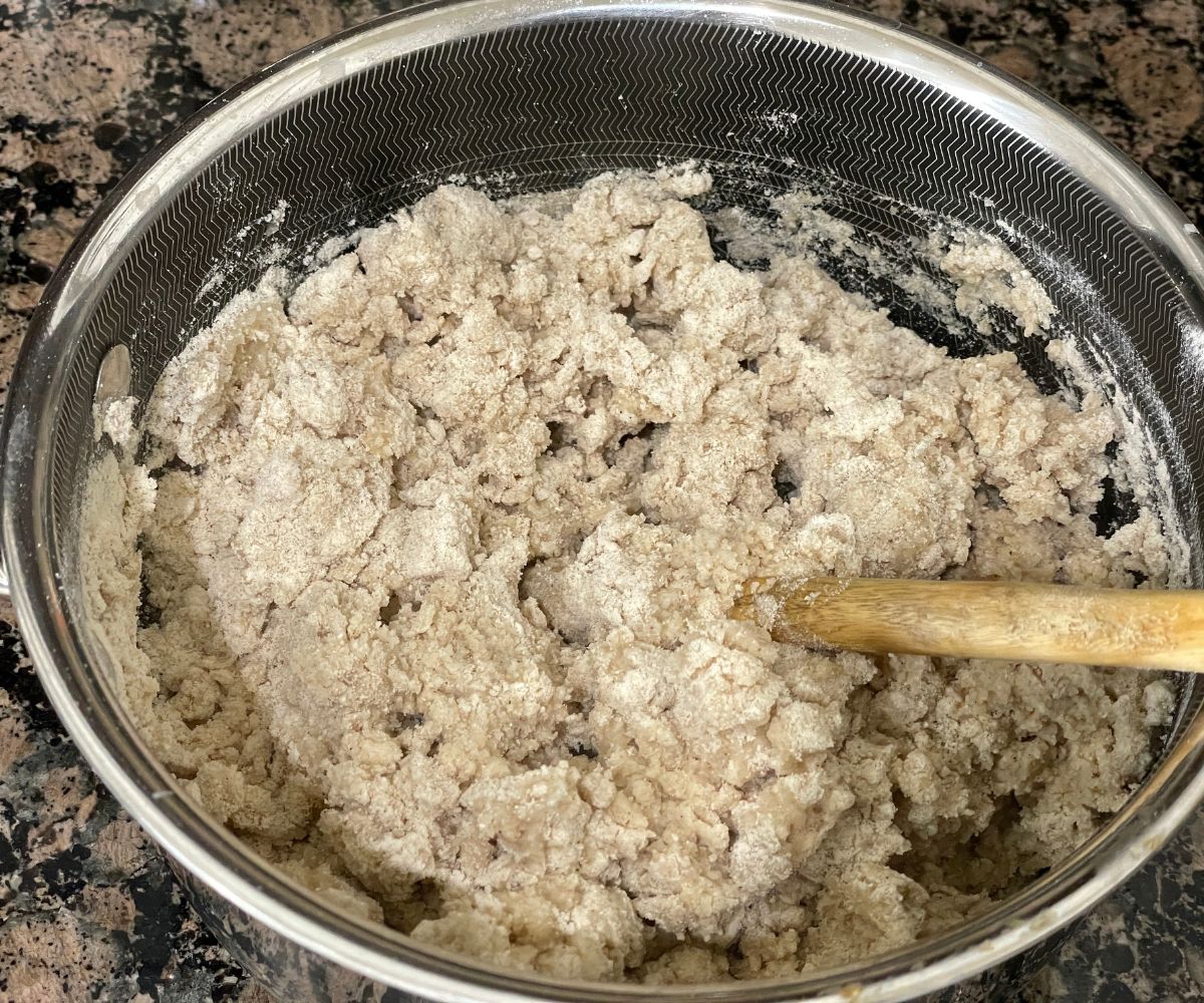 A pot is with crumbly sorghum dough.