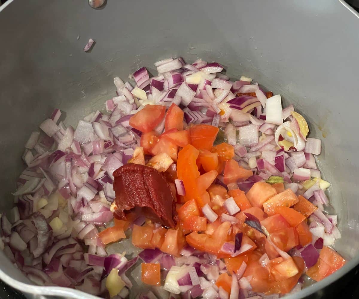 A pot is with tofu makhani masala over the heat.