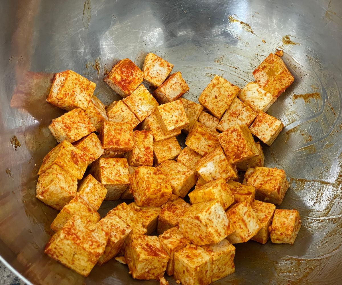 A bowl is with tofu makhani marinate.