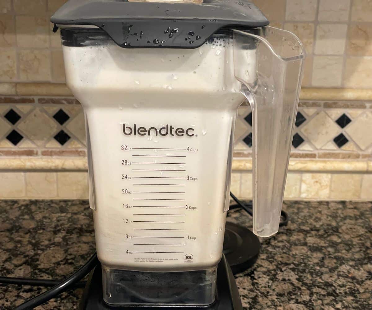 A blender is blending almonds.
