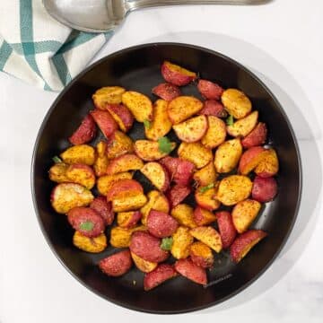 The head shot of air fryer roasted radishes is on the plate.