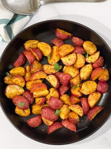 The head shot of air fryer roasted radishes is on the plate.