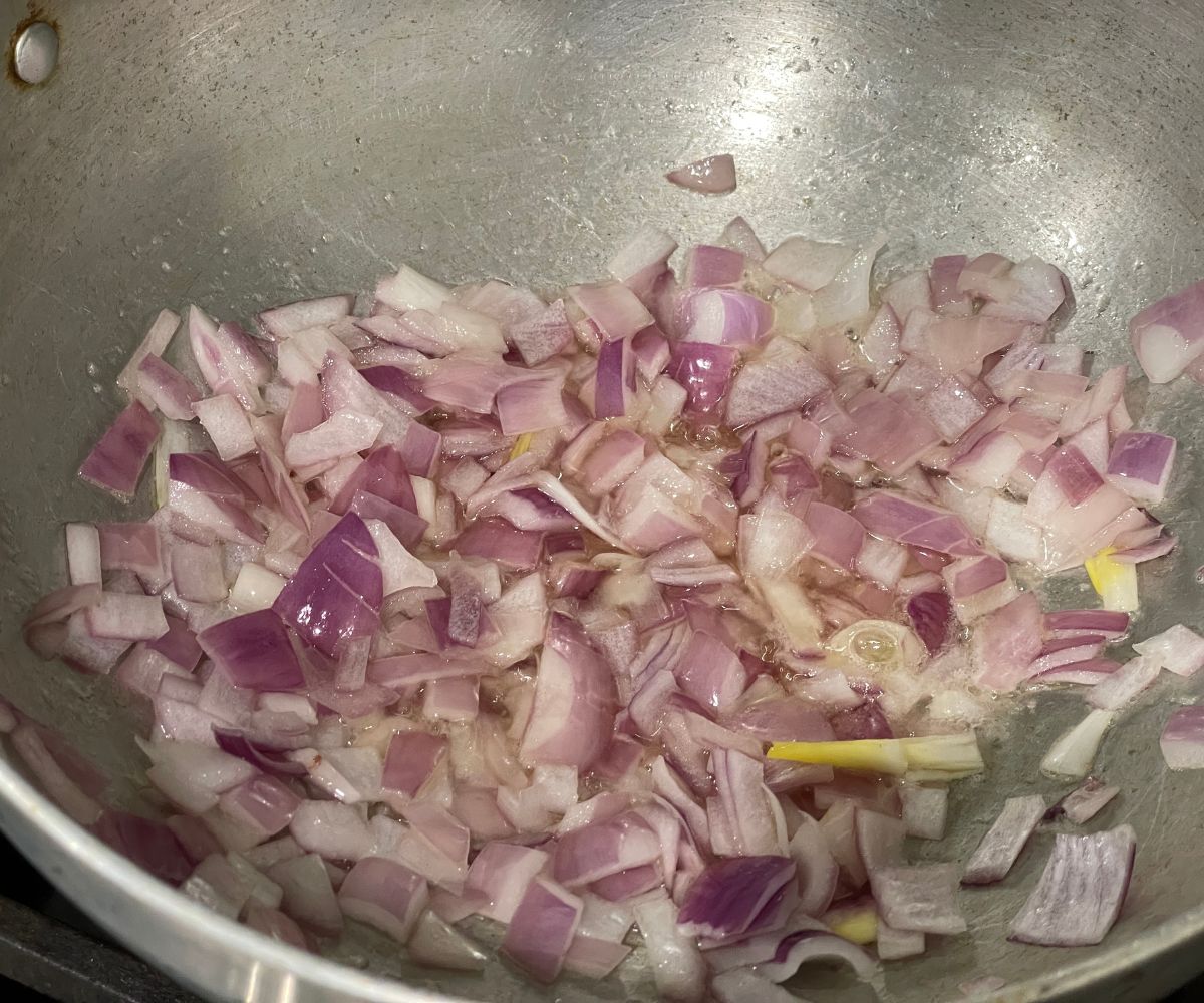 A pot is with spices and onions for bottle gourd curry.