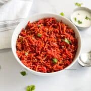 A bowl is filled with instant pot beetroot rice.