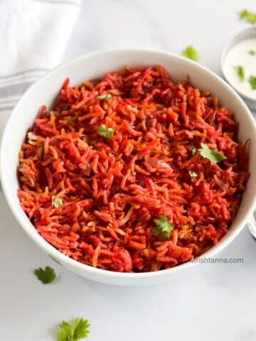A bowl is filled with instant pot beetroot rice.