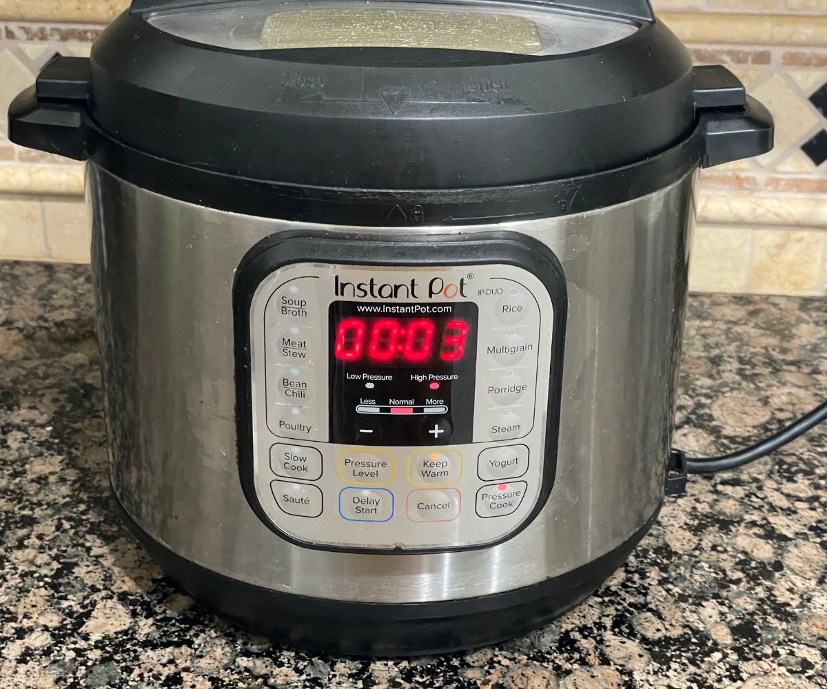 An Instant pot showing cooking time.