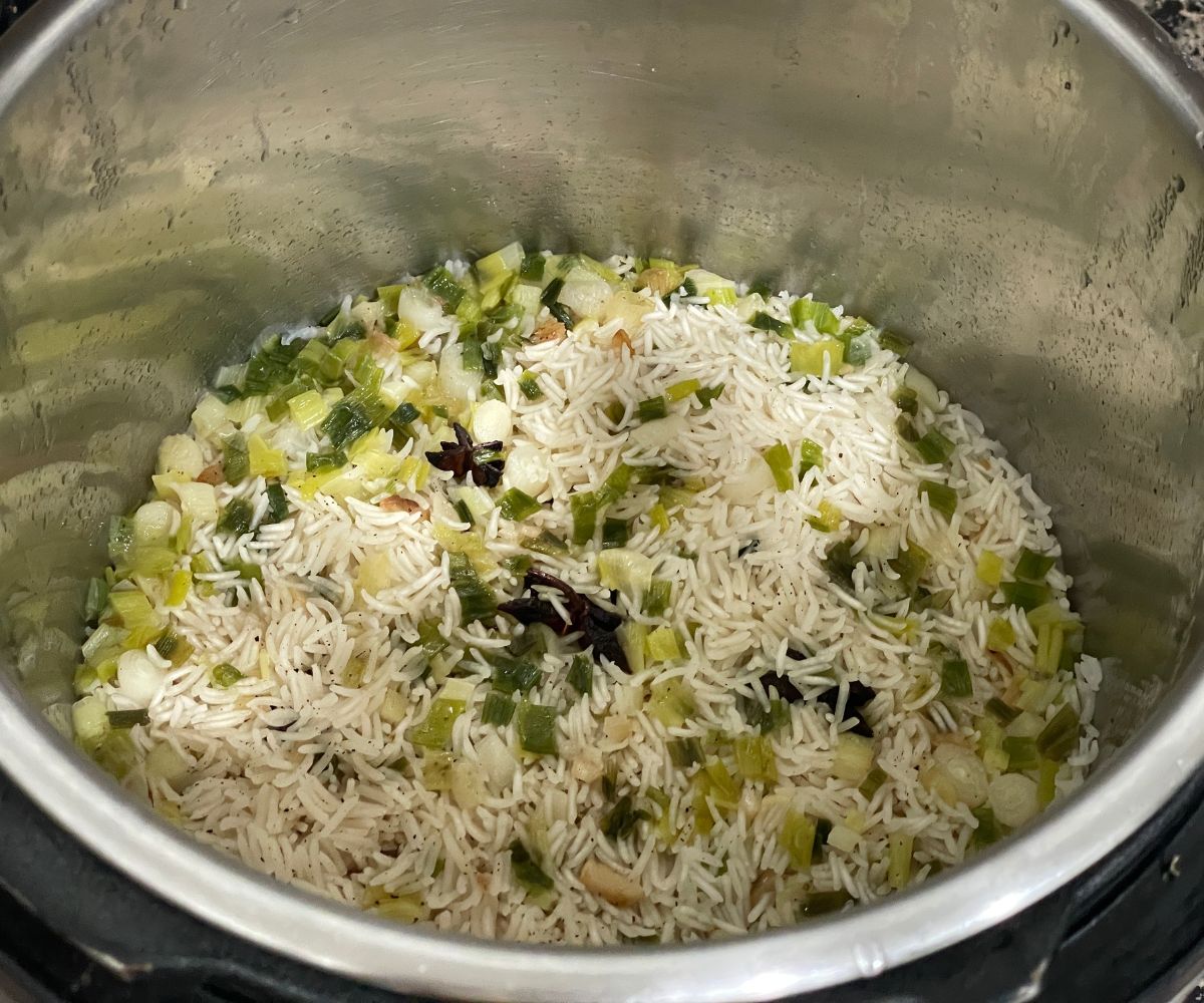 An instant pot is with scallion rice.