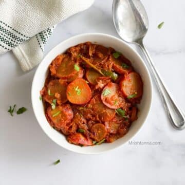 Indian radish curry is on the serving bowl.