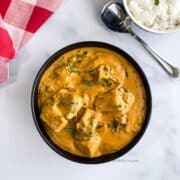 A bowl is with tofu spinach curry.