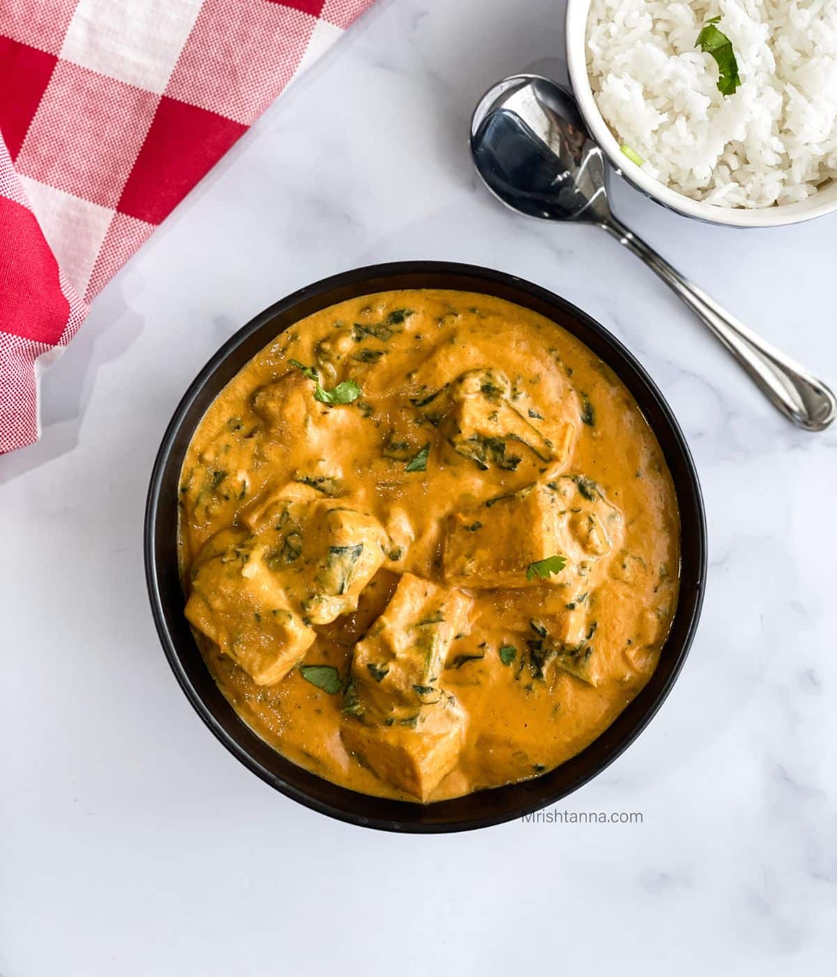 A bowl of easy tofu curry is on the table.