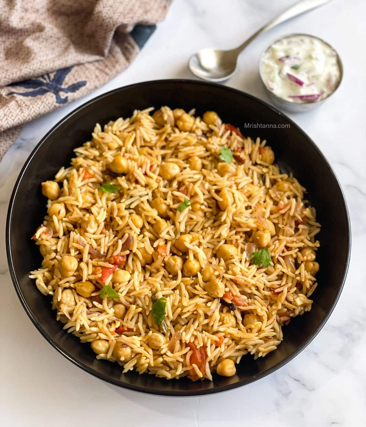 Chickpea rice is placed on the plate.