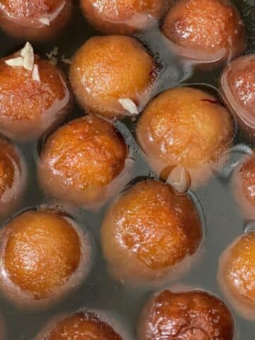 A pot is with vegan gulab jamuns.