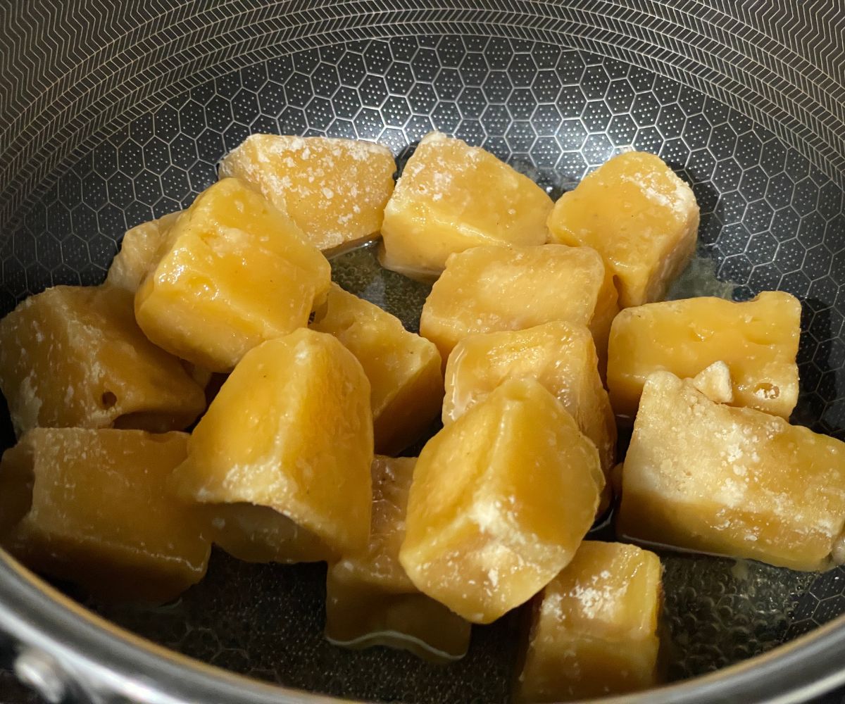 A pot is with jaggery and water.