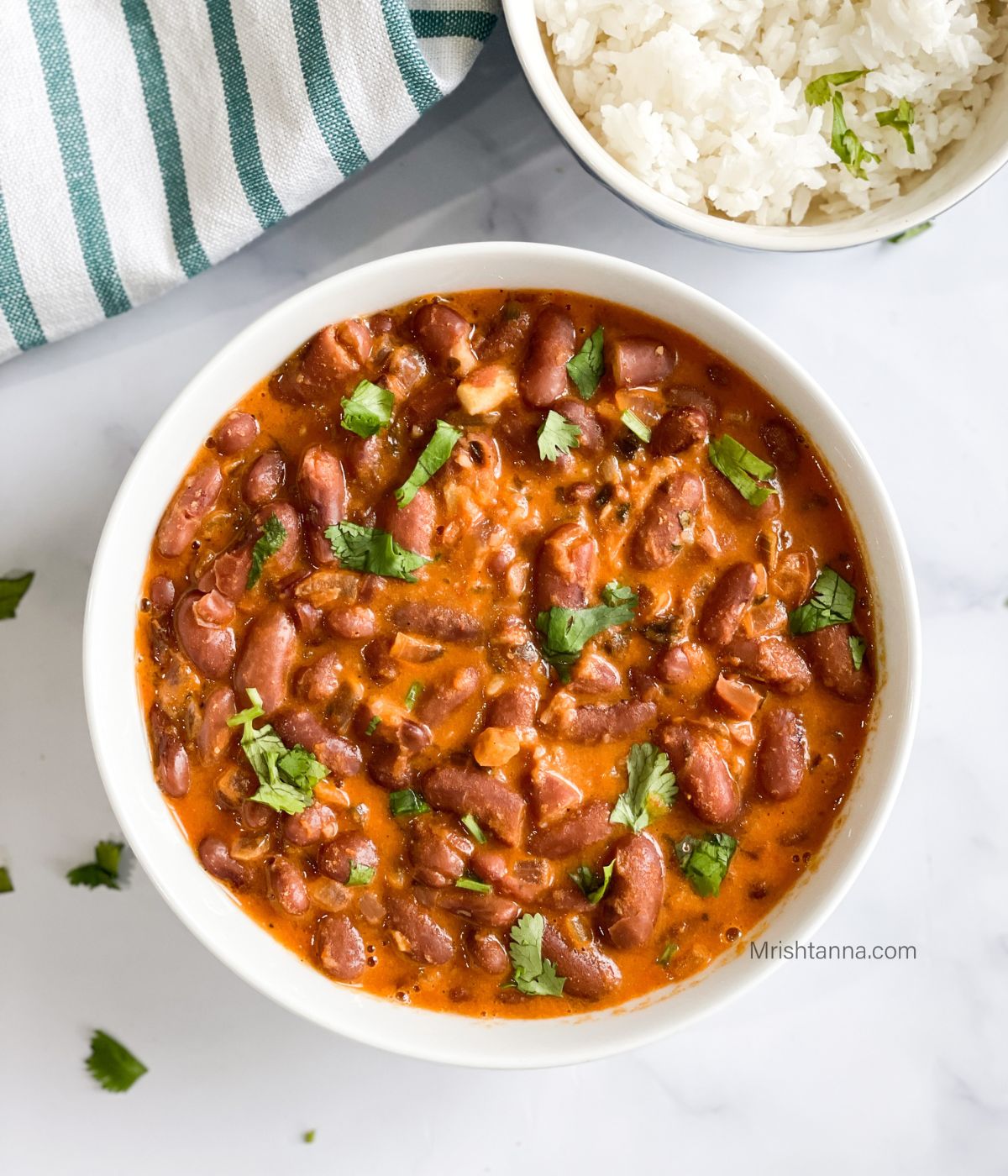 Kashmiri Rajma Masala curry is in the wide bowl.