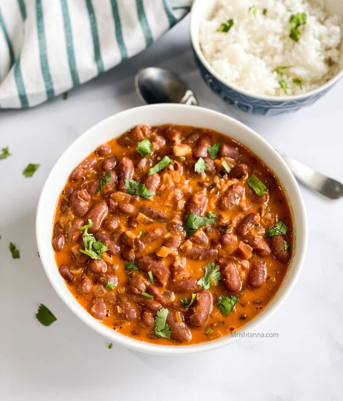 A bowl of Kashmiri rajma curry is on the table.