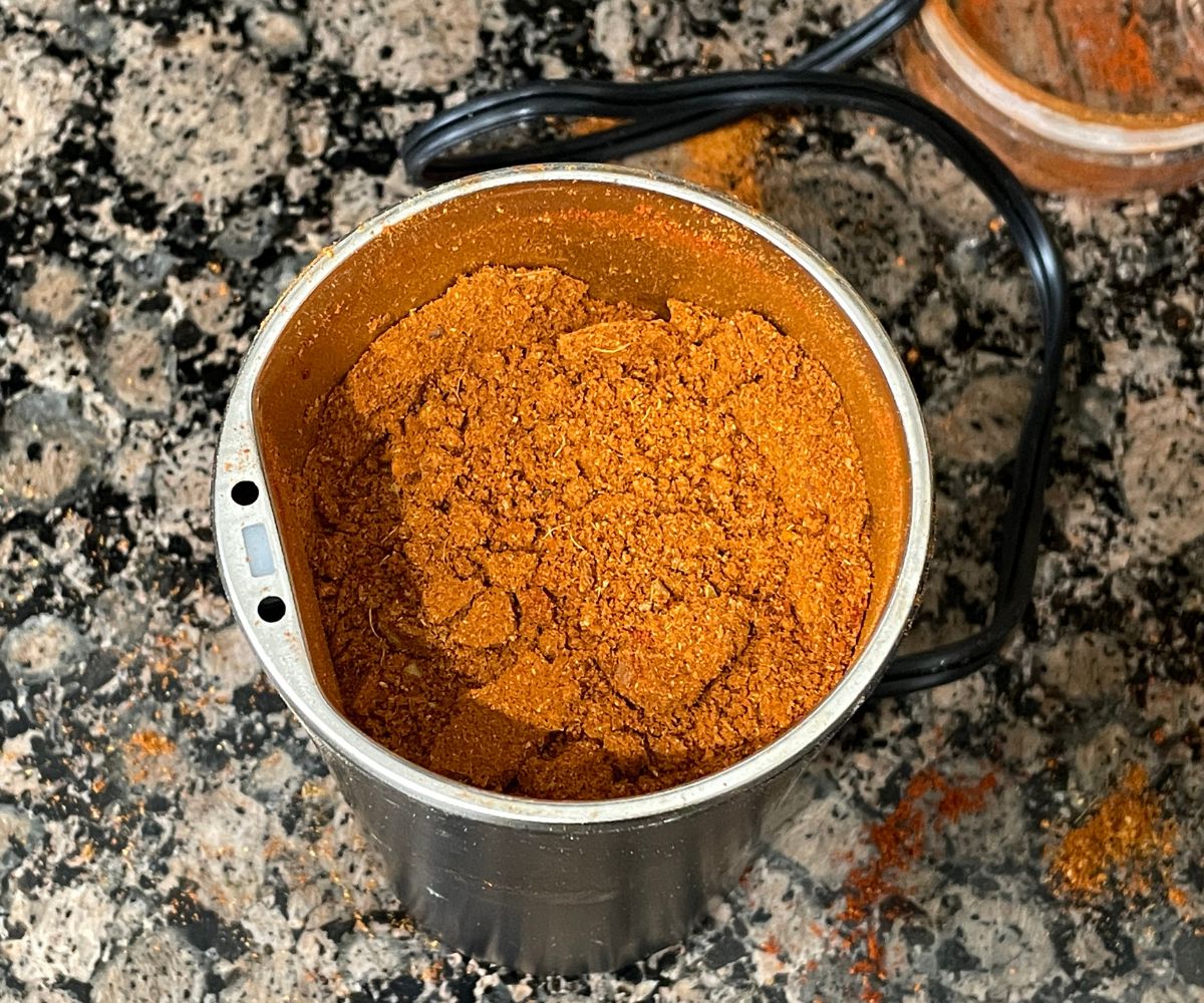 Grinder is filled with Madras curry powder.