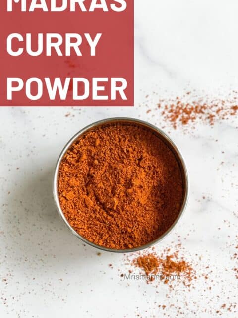 A bowl of Madras curry powder is on the surface.