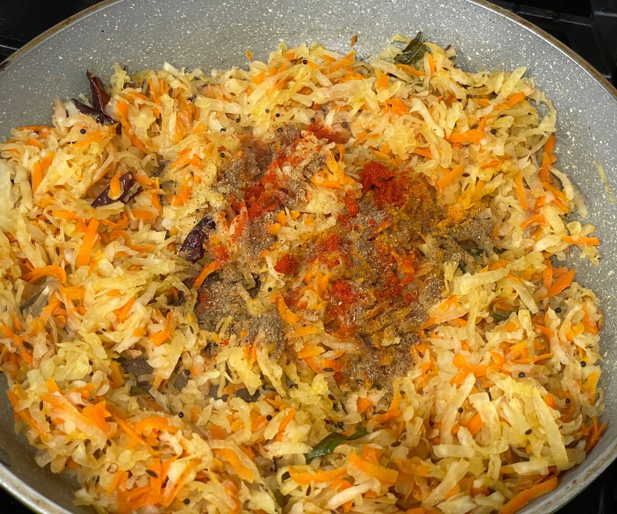 A pan is with radish stir fry over the flame.