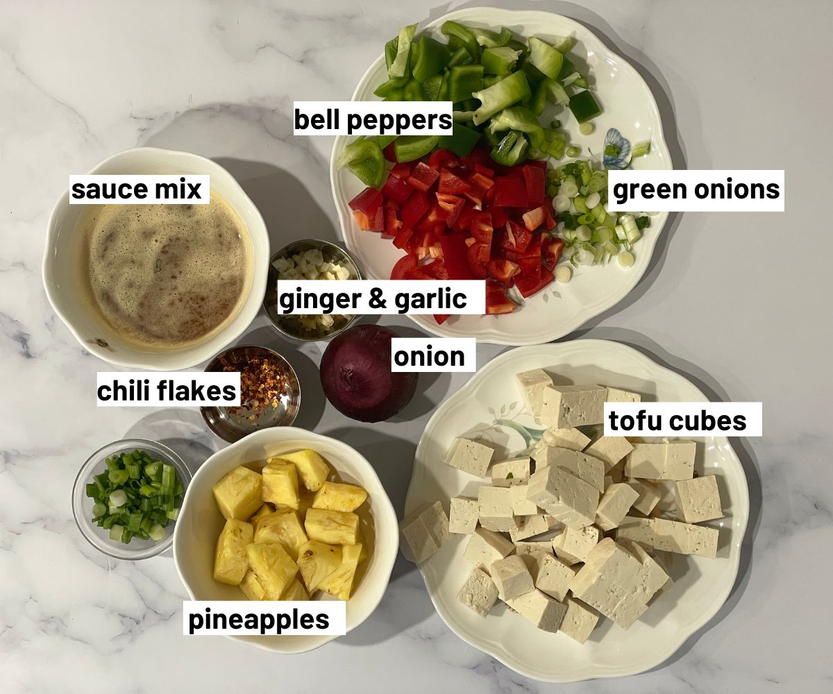 Pineapple tofu stir fry ingredients are on the table.