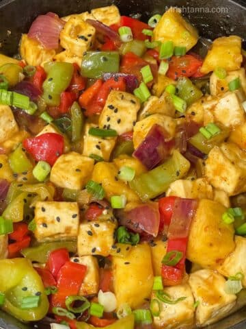 A skillet is filled with pineapple tofu stir fry.