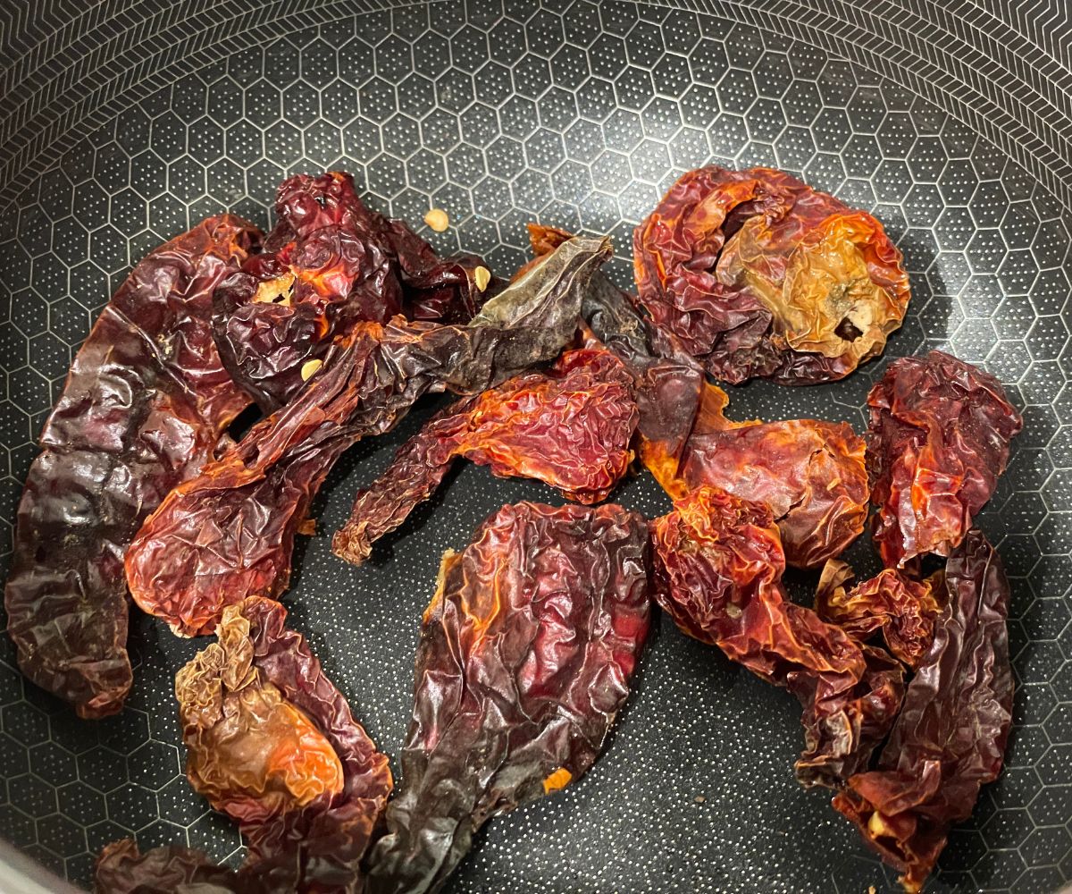 a pan is with roasted red chilies.