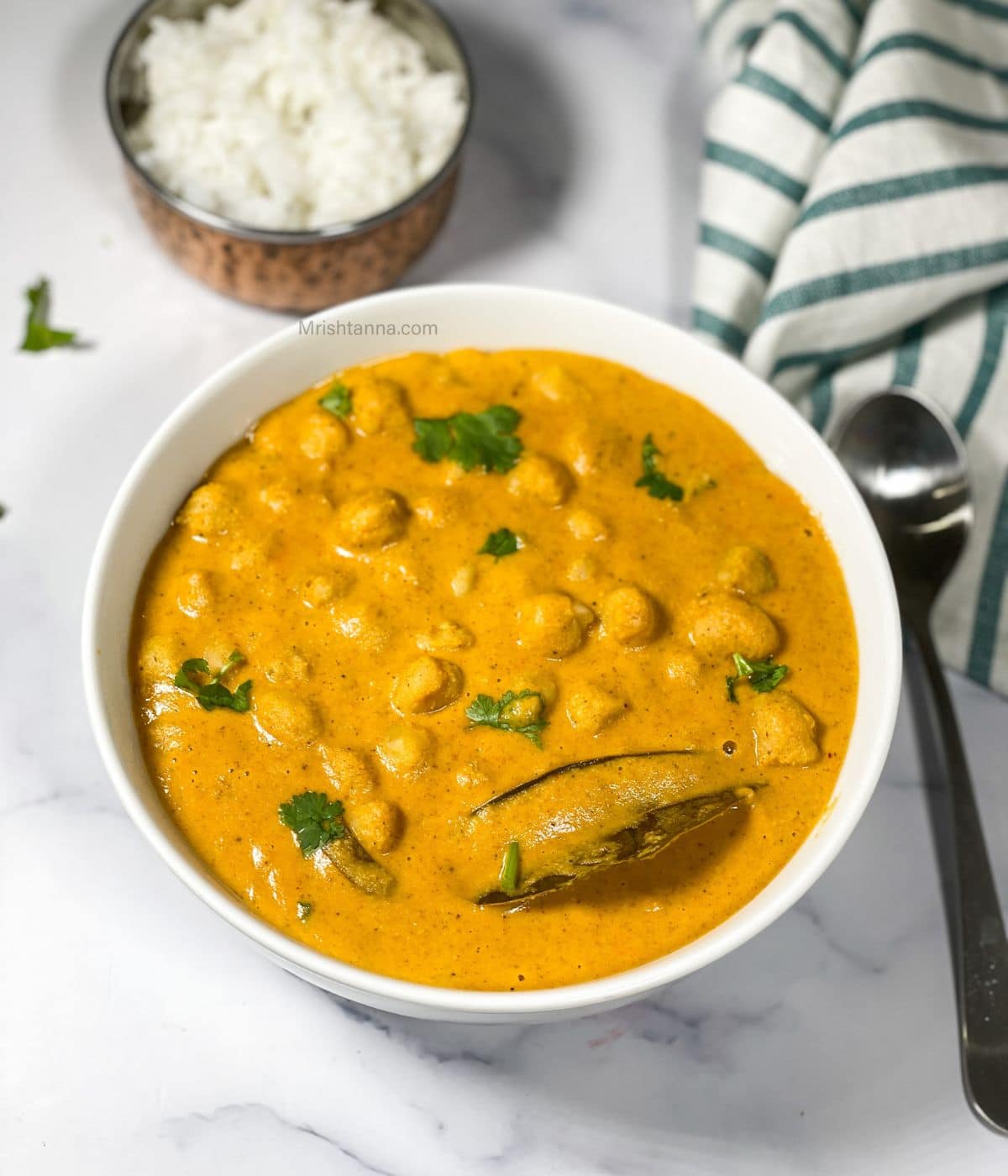 South chana masala curry is in the bowl.