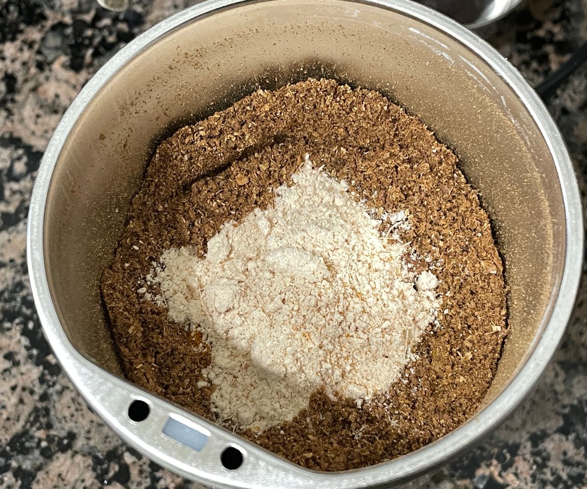 A coffee grinder is with Madras curry powder.