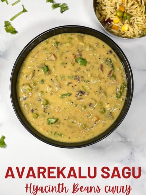 A bowl has avarekalu curry and placed on the table.