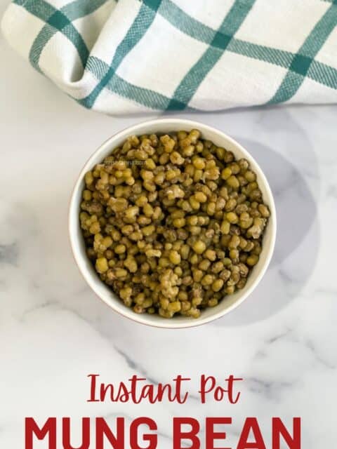 A bowl of Instant pot green moong beans are on the table.