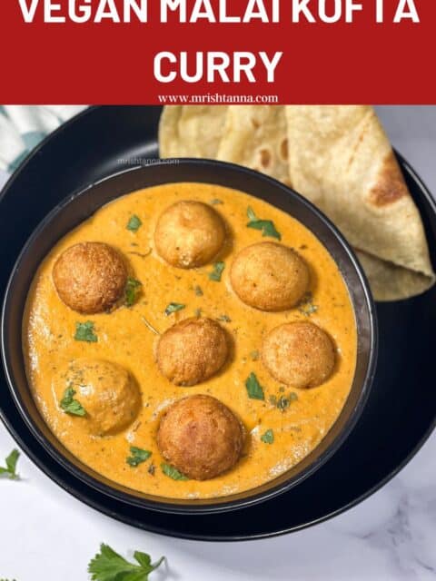 A bowl is full of vegan malai kofta curry.