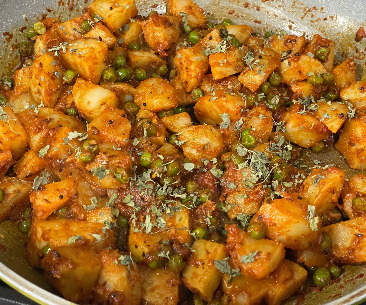 A pan has aloo matar sabzi.