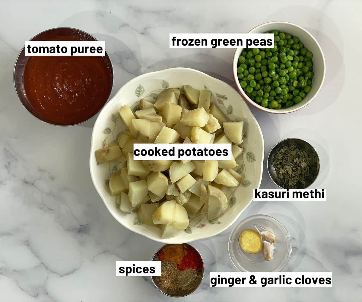 Aloo matar dry curry ingredients are on the table.