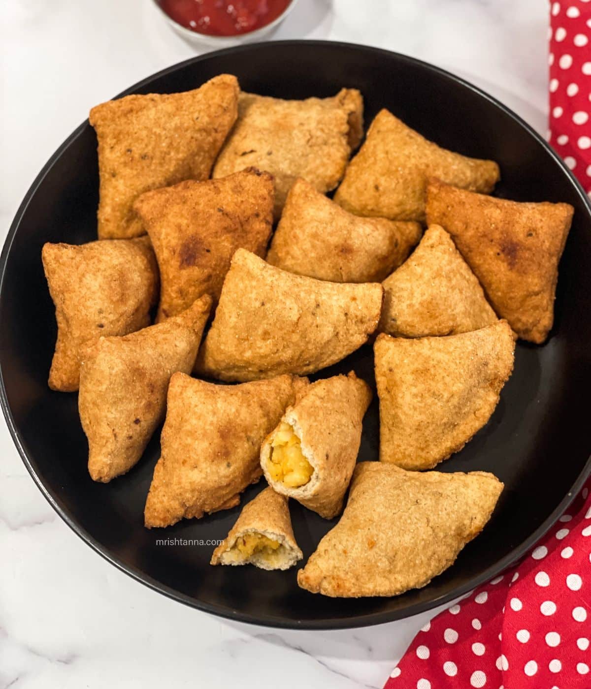 Gluten free samosas are in the plate.