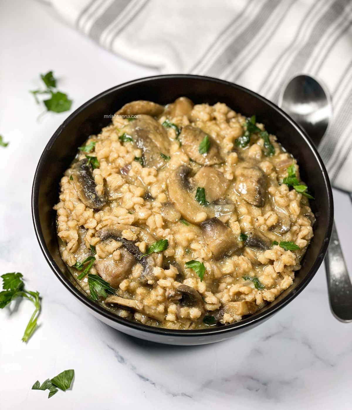 Instant pot barley mushroom risotto is in the bowl.