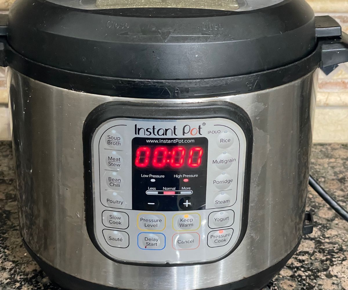 Instant pot displaying cooking time of couscous.