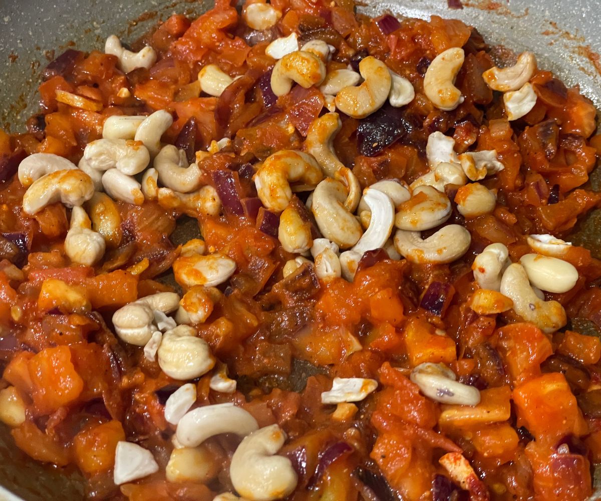 A pan has Malai kofta curry mixture.